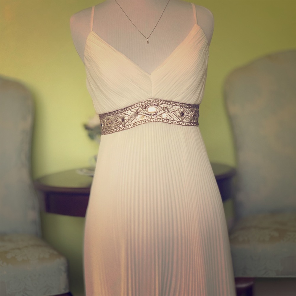 White Satin Pleated dress with beautiful Jewelry.